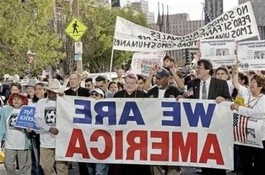 Group of people holding flags.